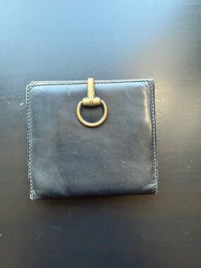 Gucci Black Leather Bifold Wallet with Gold Ring Accent